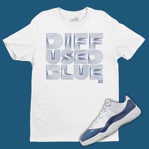May include: White t-shirt with a blue graphic that says "Diff Used Blue XI". A pair of white and blue sneakers with a blue patent leather toe.