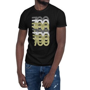 May include: A black t-shirt with a graphic design of the number 700 repeated in different shades of gray and gold.