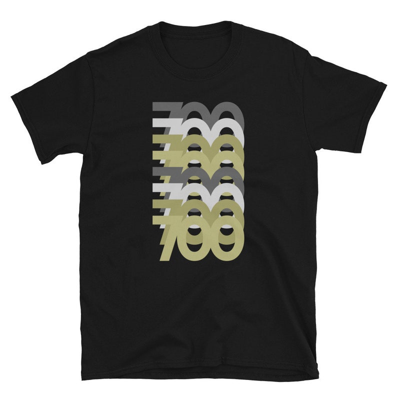 May include: Black t-shirt with a graphic design of the number 700 repeated in different shades of gray and beige.