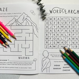 May include: A black and white illustration of a word search puzzle with the words "UMRAH", "SAFA", "MARWA", "MAKKAH", "ZAMZAM", and "IHRAM" hidden within the grid. The puzzle is surrounded by a border of brown dates.