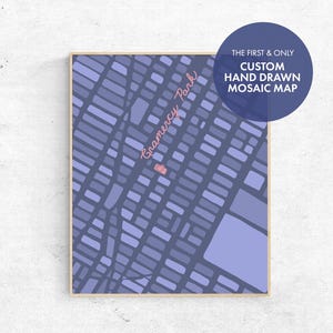 May include: A framed custom hand-drawn mosaic map of Gramercy Park in New York City. The map features a grid-like pattern in shades of blue and purple, with the text "Gramercy Park" in pink. A blue circle with white text reads "The First & Only Custom Hand Drawn Mosaic Map."
