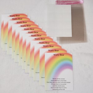 May include: A set of ten cards with a rainbow design and the text "Worry Bear" printed on each card. The cards have a message on the back that reads "Tell me all the worries you're keeping in your head. Give them all to me and I will hold instead. I'll keep them in my pocket until they shrink away. You no longer have to worry everything will be OK."