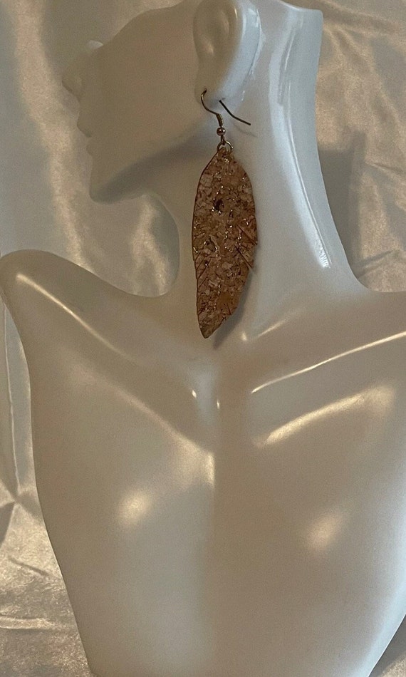 Large leather sparkling leaf shaped sparkling earrings