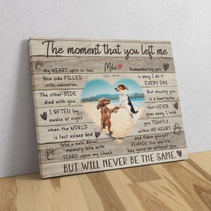 May include: A wooden canvas print with a photo of two dogs on a beach. The print features a heartfelt message about remembering a loved one who has passed away. The text reads "The moment that you left me... My heart split in two... One side filled with memories... The other side died with you... I often lay awake at night when the world is fast asleep and take a walk down memory lane with tears upon my cheek. But will never be the same."