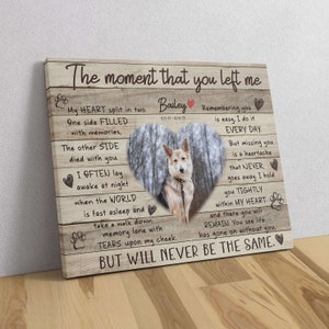 May include: A wooden canvas print with a heart-shaped photo of a dog in a forest. The print features a poem about remembering a pet who has passed away. The poem reads, "The moment that you left me, My heart split in two. One side filled with memories, The other side died with you. I often lay awake at night when the world is fast asleep and take a walk down memory lane with tears upon my cheek. But will never be the same."