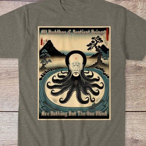May include: A grey t-shirt with a graphic print of a man with an octopus head. The text on the graphic reads "All Buddhas & Sentient Beings Are Nothing But The One Mind".