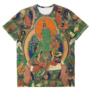 May include: Crew neck t-shirt featuring a detailed, colorful illustration of a deity with a green complexion, surrounded by other figures and floral elements. The design has an aged, vintage appearance, with a central orange halo.