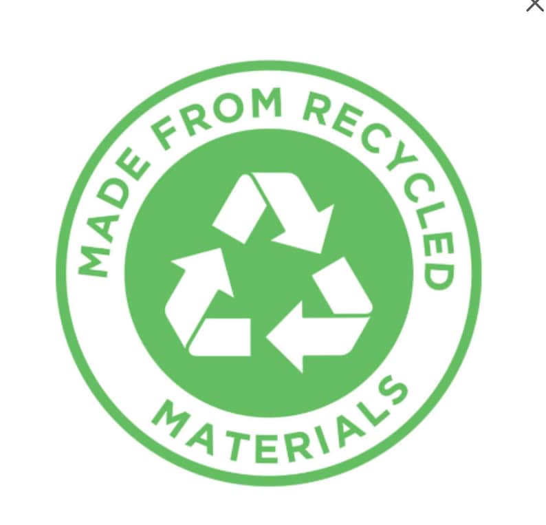 May include: A circular green and white graphic with the text "MADE FROM RECYCLED MATERIALS". The graphic features a recycling symbol in the centre, composed of three white arrows in a triangular formation.