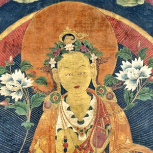 May include: A painting of a deity with a golden halo, wearing a crown of flowers and a yellow robe. The deity has a serene expression and is surrounded by floral motifs.