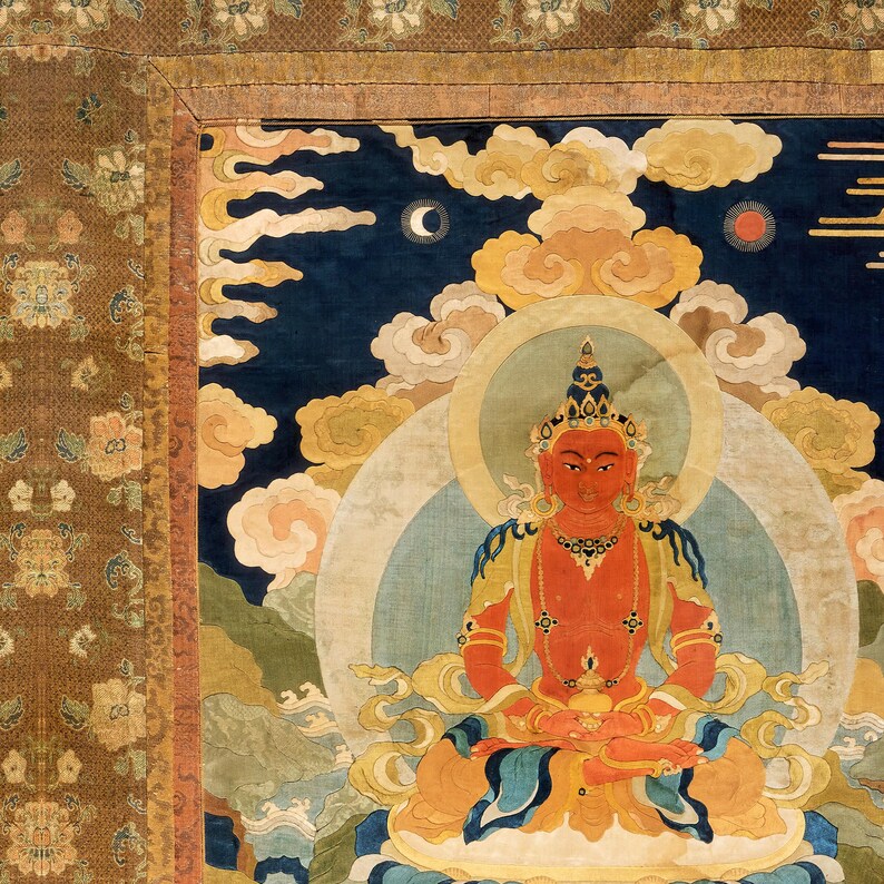 May include: A detailed, colorful tapestry depicting a seated figure with a red complexion, adorned with gold jewelry and a crown. The figure is surrounded by clouds, a crescent moon, and a sun against a dark blue background. The tapestry has a decorative border.