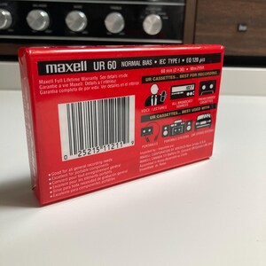 May include: A red Maxell UR 60 audio cassette tape package featuring a barcode, technical specifications including Normal Bias and IEC Type I, and graphic icons illustrating compatibility with voice recorders, radios, and portable stereo systems.