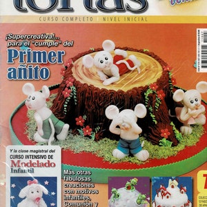 Puede incluir: Portada de revista con una tarta decorada con forma de tocón de árbol, con figuras de ratones. La portada tiene texto en español, incluyendo "Decoración de Tortas" y "Primer añito".