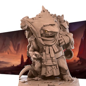 May include: A detailed, tan-colored fantasy figurine of a creature with a hooded cloak, backpack, and various pouches. The creature has a fish-like face with a single visible yellow eye. It stands on a wooden base, with a blurred background.