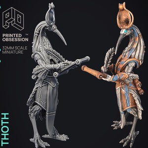 May include: A 32mm scale miniature of the Egyptian god Thoth, depicted as a bird-headed human with a scroll in one hand and a feather in the other. The miniature is shown in both a grey unpainted version and a painted version with gold, blue, and brown accents.