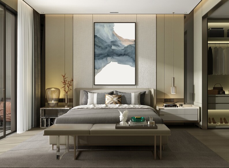 May include: A modern bedroom with a large bed, a grey upholstered headboard, and a grey and white patterned throw pillow. The bed is dressed in grey linens and has a grey bench at the foot of the bed. There is a large abstract painting on the wall behind the bed.