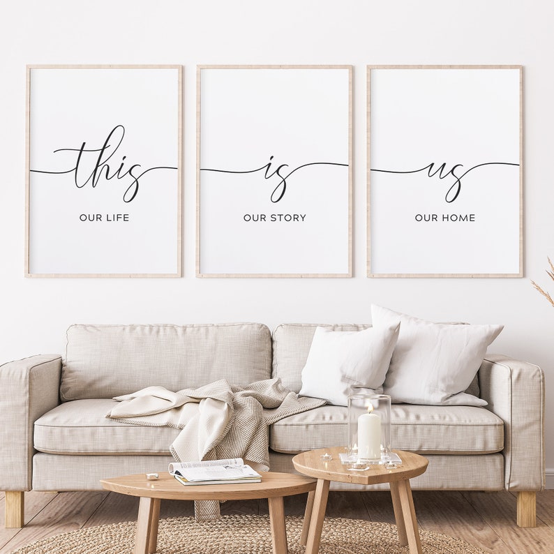 May include: Three black and white framed prints with the text "this is us" and the words "our life", "our story", and "our home" underneath each word.