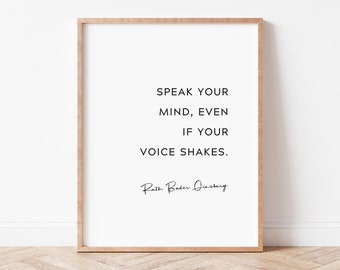May include: A framed print with a quote by Ruth Bader Ginsburg: "Speak your mind, even if your voice shakes."
