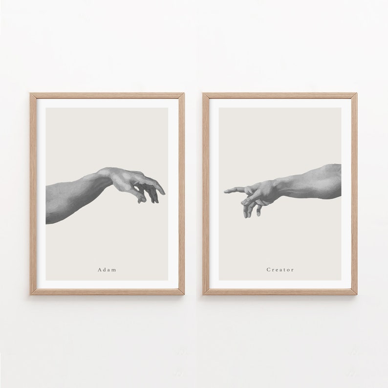 May include: Two framed black and white prints of hands reaching towards each other. The left print is labeled "Adam" and the right print is labeled "Creator".