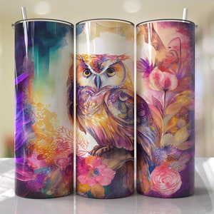 May include: Three stainless steel tumblers with colorful watercolor designs featuring an owl, flowers, and leaves. The owl is brown and yellow with a purple background. The flowers are pink and yellow with a purple background. The leaves are green and yellow with a purple background.