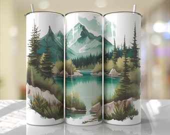 Puede incluir: Tres vasos de acero inoxidable con un diseño de acuarela de un lago de montaña y un bosque. El diseño presenta un lago azul, árboles verdes y una cordillera en el fondo.
