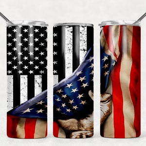 May include: Three stainless steel tumblers with a patriotic American flag design. The tumblers feature a red, white, and blue American flag with stars and stripes. The flag is shown being held by a hand.