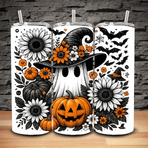 May include: Three white insulated tumblers with black straws feature Halloween-themed designs. One tumbler has a ghost wearing a witch hat, surrounded by pumpkins and sunflowers. The other two tumblers have sunflowers, bats, and pumpkins.