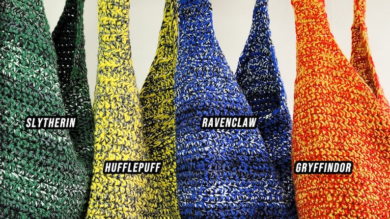 May include: Crocheted tote bags in green, yellow, blue, and red, each with a white accent. The bags are labeled with the names "Slytherin," "Hufflepuff," "Ravenclaw," and "Gryffindor" in white text, representing different houses.