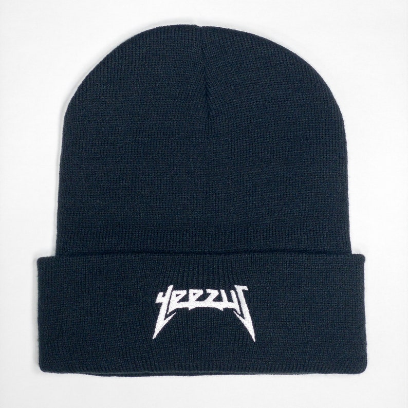 May include: Black beanie with a white "YEEZY" logo embroidered on the front.