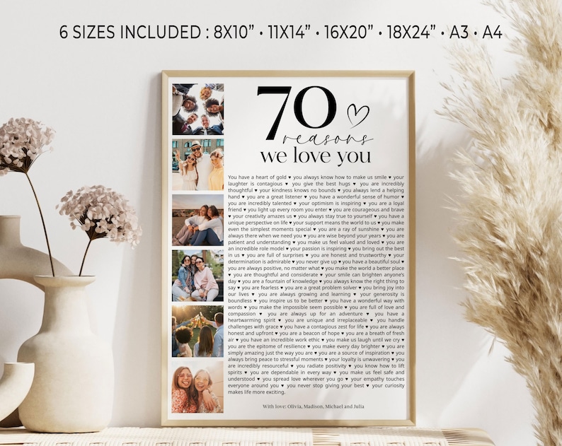 May include: A framed print with a white background and black text. The text reads "70 reasons we love you" and lists 70 reasons. The print includes several photos of people. The print is framed in a light wood frame.