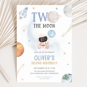 May include: A blue and white invitation card featuring a cartoon astronaut holding a blue balloon with the number 2 on it. The card reads "Two the Moon" and "Oliver's Second Birthday". The card also includes the date and time of the party, the location, and the RSVP details.