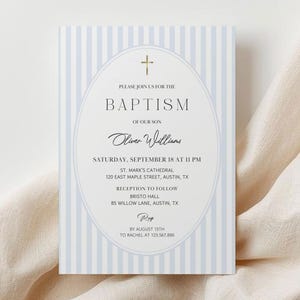 May include: Baptism invitation with a light blue striped background. The invitation features an oval frame with a gold cross at the top. The text reads "Please join us for the Baptism of our son Oliver Williams."