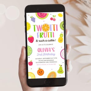 May include: A smartphone displays a colorful invitation for Olivia's 2nd birthday party. The design features cartoon fruits like watermelon, strawberries, and kiwi. Text reads "Twotti Frutti & such a cuttie!" and event details.