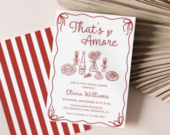 May include: Red and white striped card with a red border and text that reads "That's Amore" with a heart symbol. The card is an invitation to a bridal shower for Olivia Williams. The invitation includes the date, time, and location of the shower.