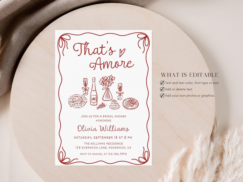 May include: A white printable bridal shower invitation with red text and illustrations. The text reads "That's Amore" and includes the bride's name, date, time, and location. The illustrations include a bottle of wine, glasses, pizza, and flowers.