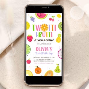 May include: A smartphone displays a colorful invitation for Olivia's 2nd birthday party. The design features cartoon fruits like watermelon, strawberries, and oranges. Text reads "Twotti Frutti & such a cuttie!" and includes party details.
