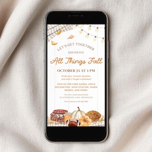 May include: A smartphone displaying a digital fall-themed invitation with text reading LET'S GET TOGETHER AND ENJOY All Things Fall OCTOBER 24 AT 4 PM. The design features watercolor illustrations of pumpkins, a football, and string lights.