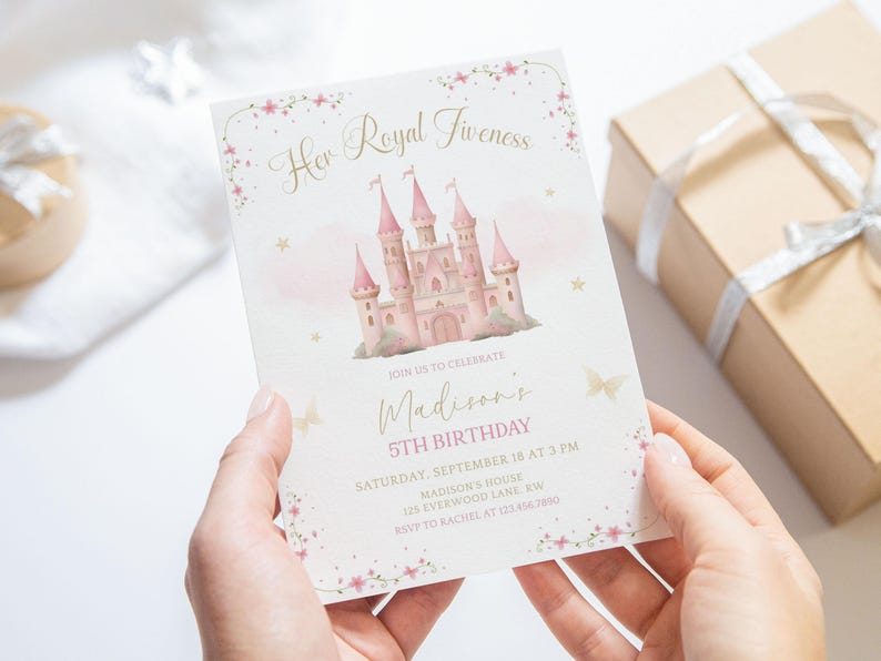 May include: A pink and gold invitation card with the text "Her Royal Fiveness" and "Madison's 5th Birthday". The card features a pink castle illustration and floral accents. A gift box is in the background.