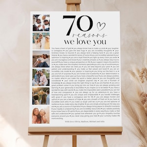 May include: A white poster with a black heart and the text "70 reasons we love you" printed on it. The poster is decorated with photos of people in a collage style.