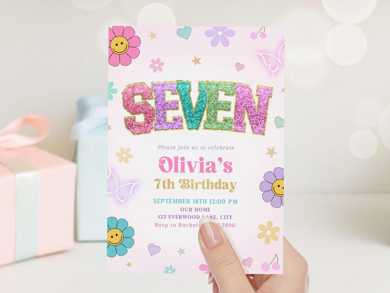 May include: A pink invitation card with the word "SEVEN" in glittery letters. The card is decorated with flowers, butterflies, and stars. The text reads "Olivia's 7th Birthday" and includes event details.