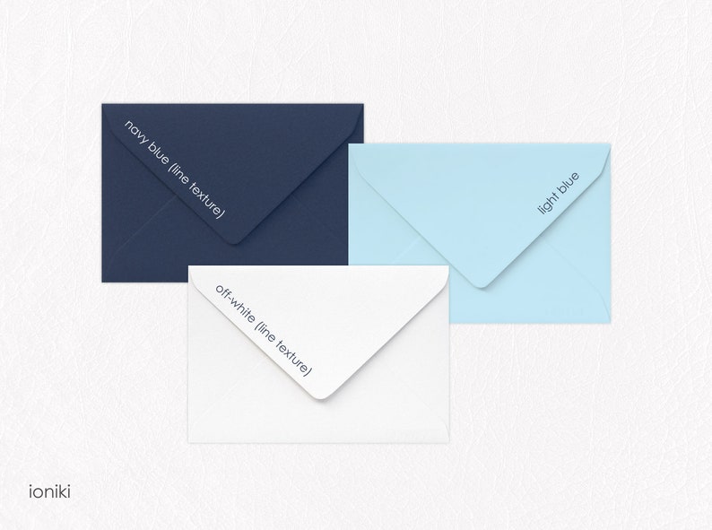 May include: Three envelopes in different colors: navy blue, off-white, and light blue. Each envelope has a subtle line texture and the color name printed on the flap.