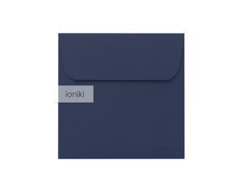 May include: A dark blue square envelope with the word "ioniki" printed on the front.