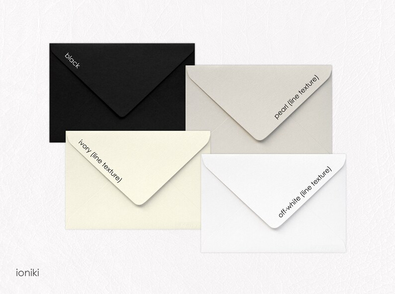 May include: Four envelopes in different colors: black, ivory, pearl, and off-white. Each envelope has a subtle line texture and the color name printed on the flap.