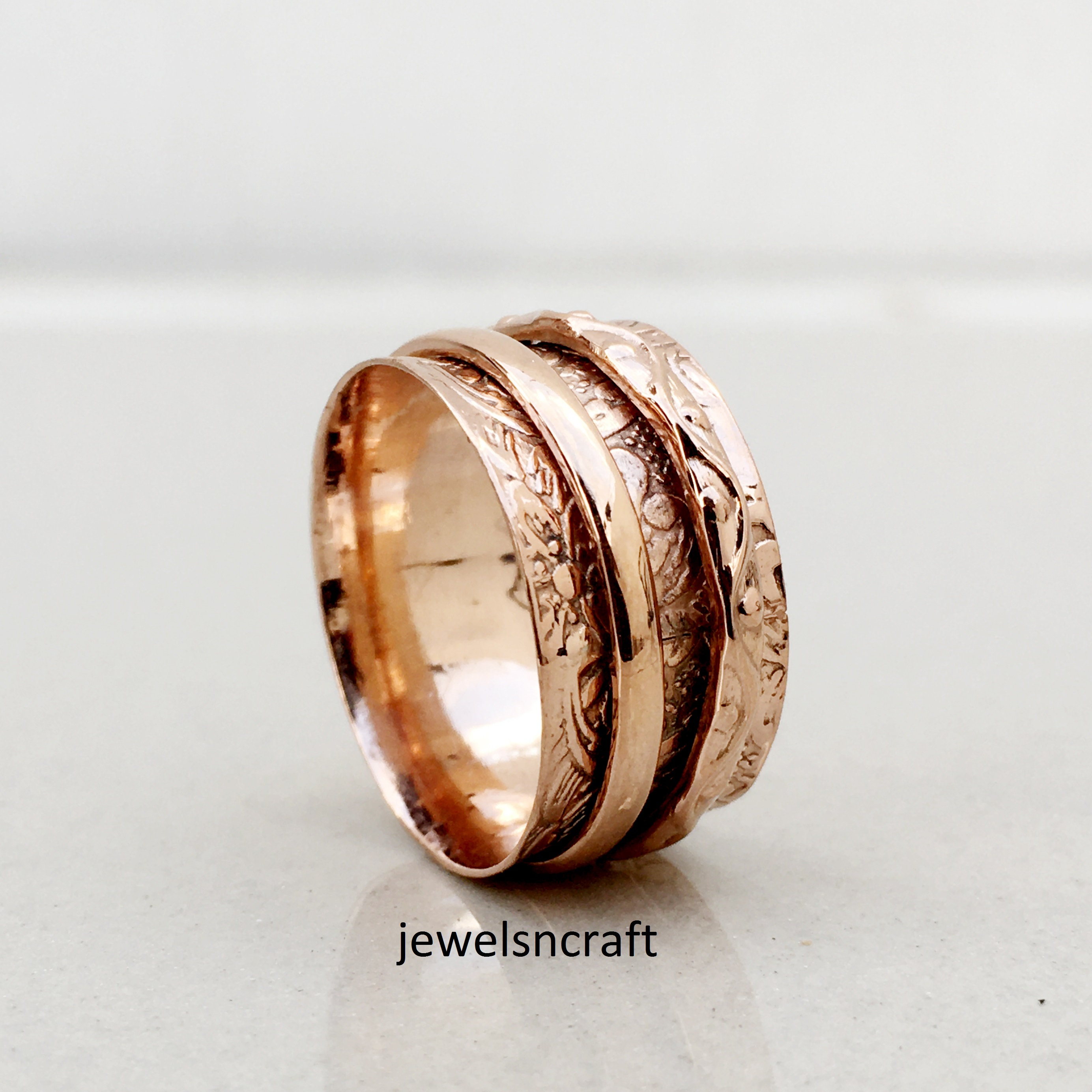 Rose gold spinner best sale ring