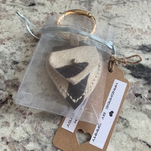 Repurposed Pony skin leather pick holder.