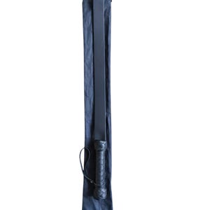 May include: A black leather paddle with a braided handle, in a black fabric carrying case.