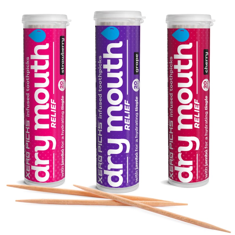 May include: Three cylindrical containers of infused toothpicks, each with a different color and flavor: strawberry, grape, and cherry. The containers are labeled "dry mouth RELIEF" and include the text "with jamb&uacute; for a hydrating tingle."