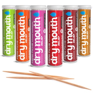 May include: Six cylindrical containers of "dry mouth" infused toothpicks in various flavors: lemon lime, orange, tropical mint, cinnamon, caramel apple, and churro. Each container has a different color and a blue droplet logo. Several wooden toothpicks are in front of the containers.