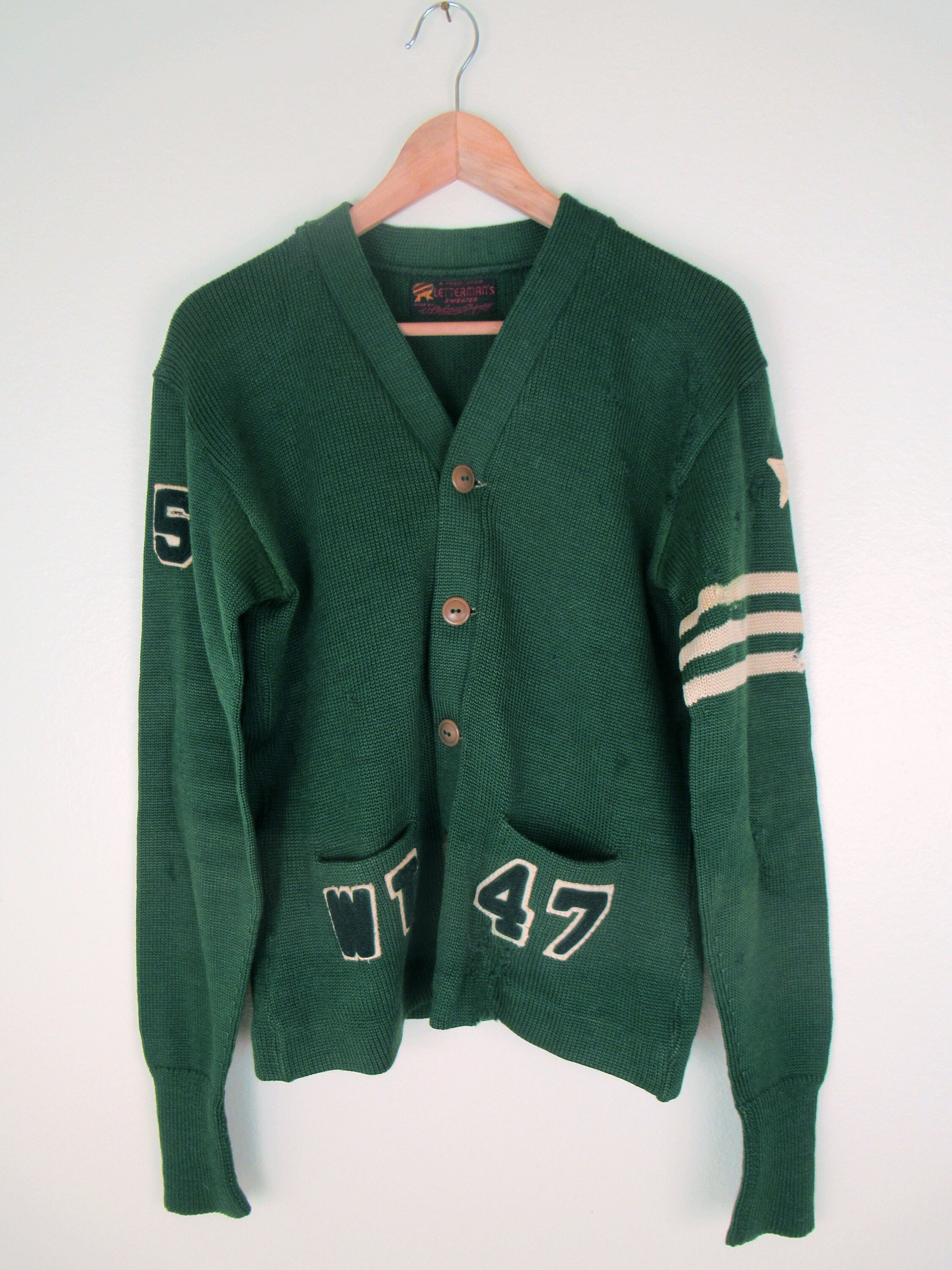 green varsity sweater