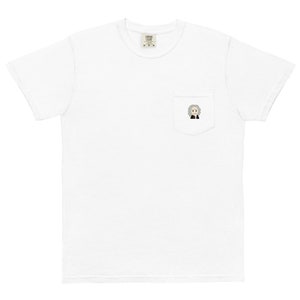 May include: White t-shirt with a small pocket on the left chest. The pocket has a cartoon image of a person with gray hair and a black jacket.