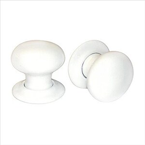 May include: Two white ceramic door knobs with a round shape and a flat base. The knobs are designed for use on interior doors.